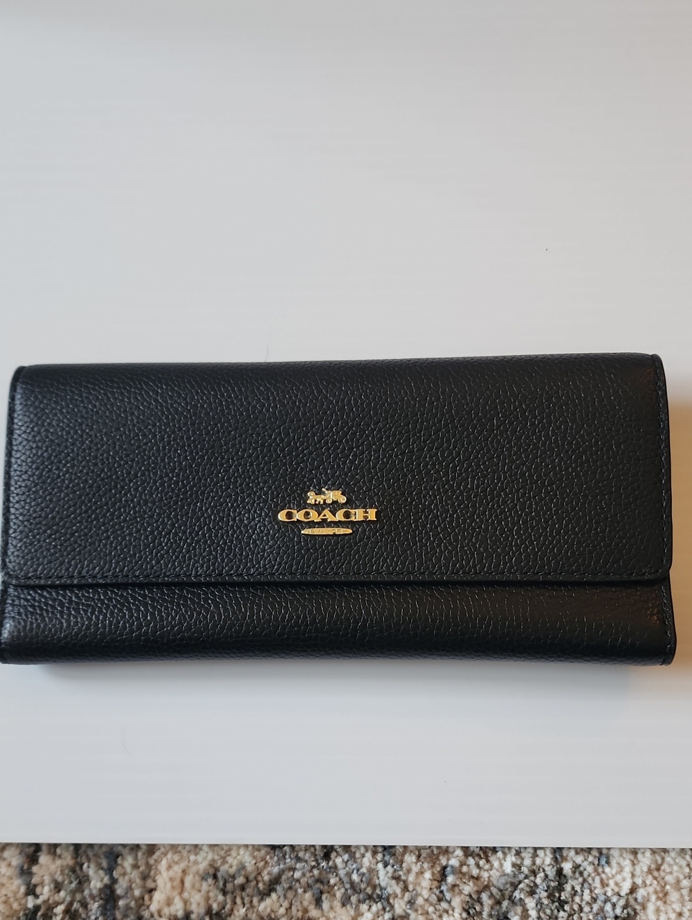 Coach Black Pebbled Leather Trifold Wallet with Gold Logo. 7.75×3.75